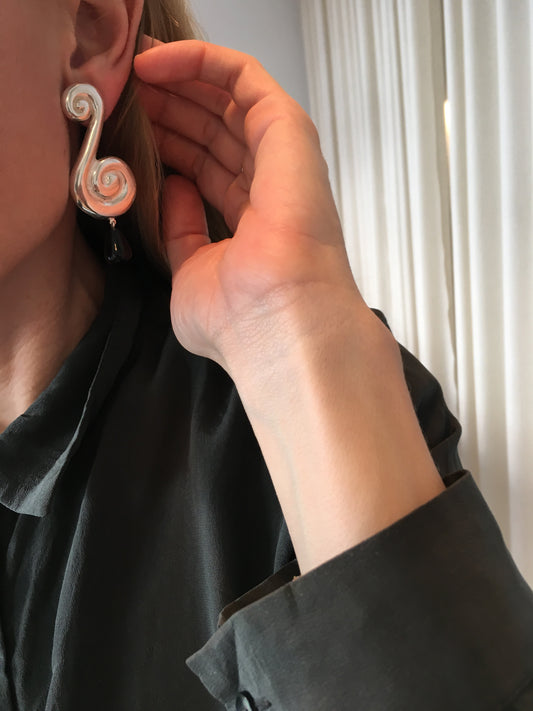 Large ? earring.
