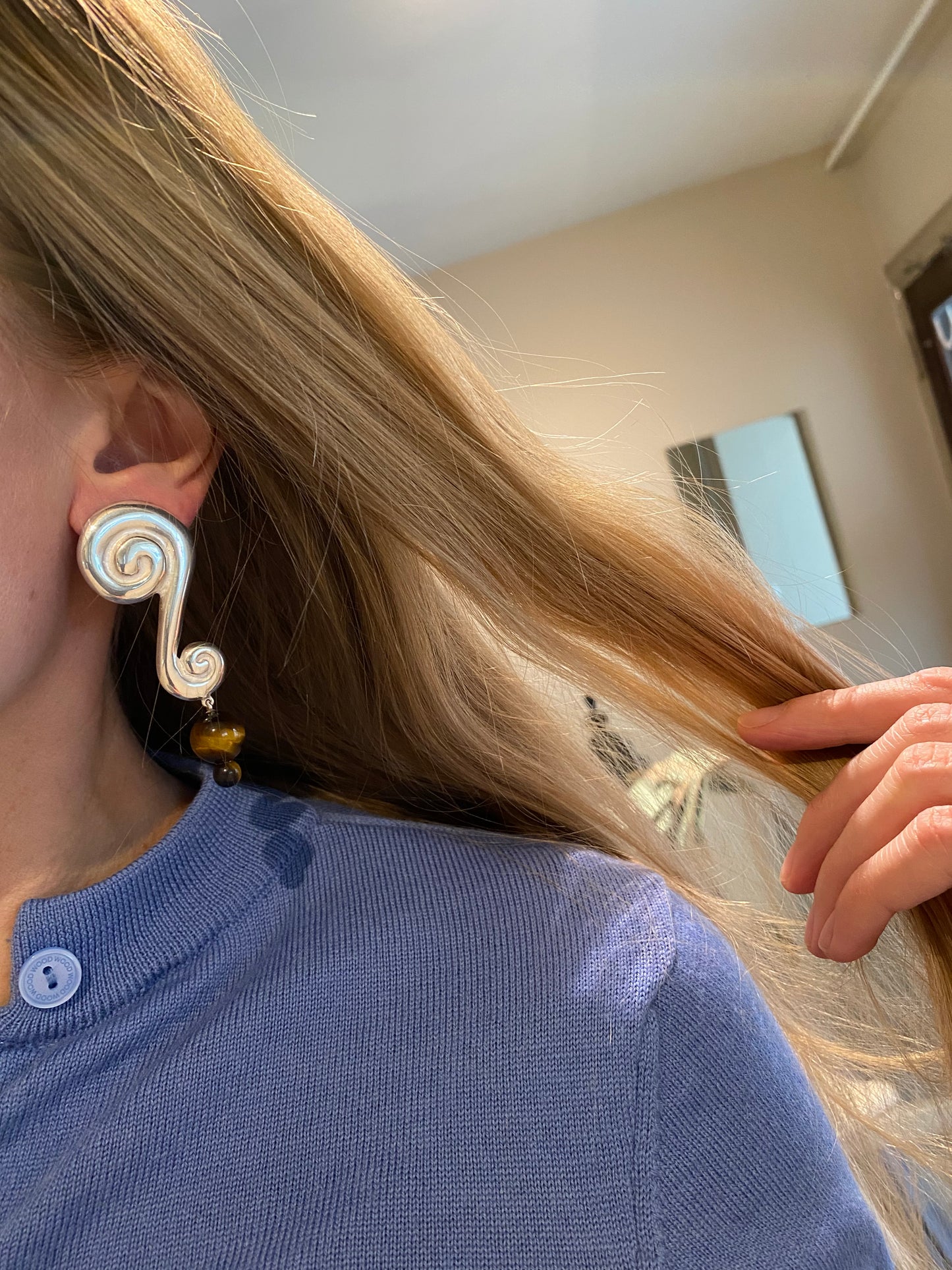 Large ? earring.